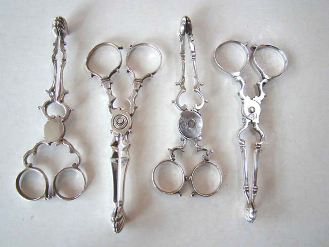 A group of four Georgian silver sugar nips circa 1739-1760